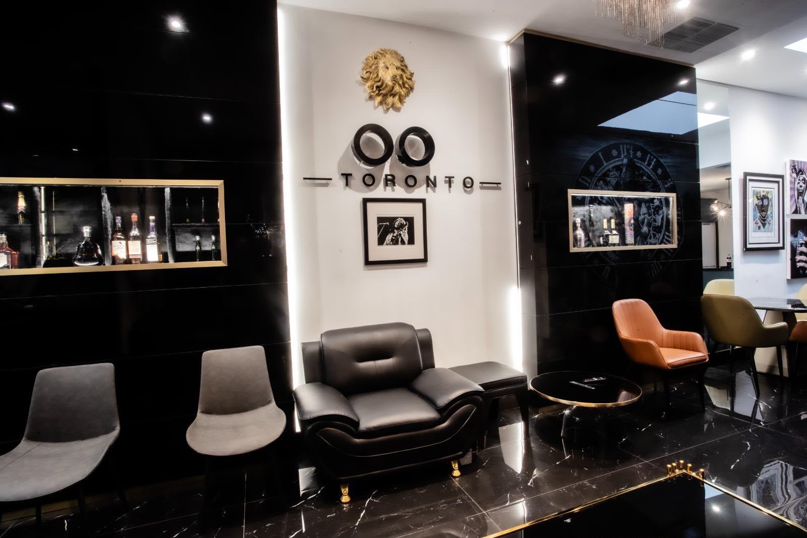 Lounge entrance wall with the gold lion and OO Toronto signage
